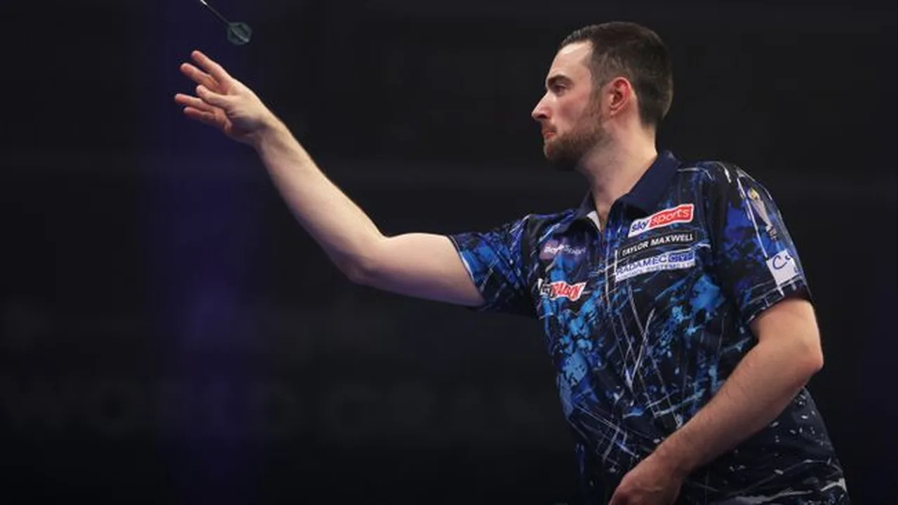 Photograph of a darts player throwing a dart on stage during a televised event