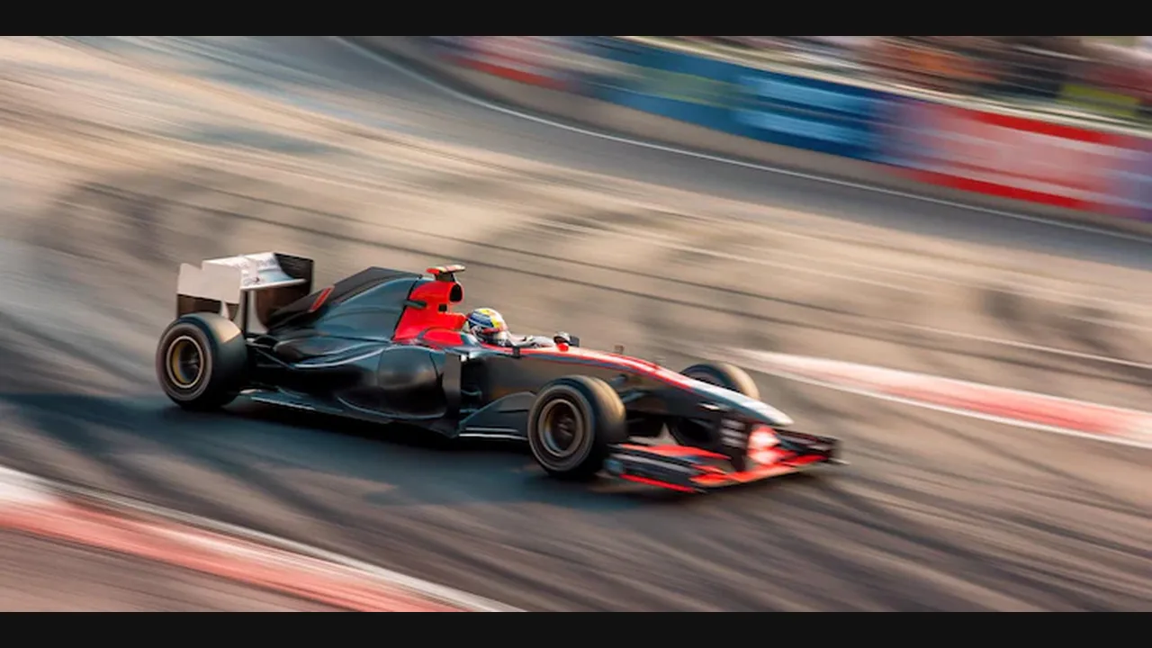 Photograph of a red and black Formula 1 car speeding around a track with motion blur
